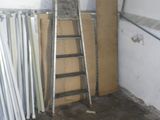 a ladder leaning against a wall in a garage