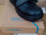 a box with a pair of black shoes on top of it