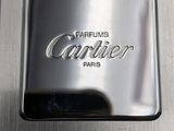 silver plate with the word carrier on it sitting on top of a metal surface