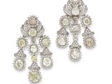 a pair of yellow and white diamond earrings