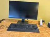 an image of a computer desk with a keyboard and monitor