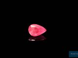 a pink diamond on a black background