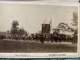 an old photo of a group of people riding horses