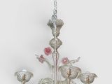 une image représentant un lustre orné de fleurs suspendu au plafond