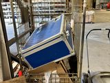 a cart that has a cooler on top of it