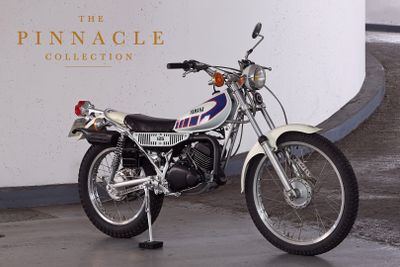 a motorcycle that is parked in front of a wall