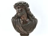 bronze bust of a man with a crown of thorns on his head