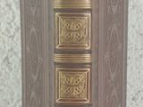 a brown book that is sitting on a table