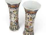 pair of chinese vases with birds and flowers on them on a white background