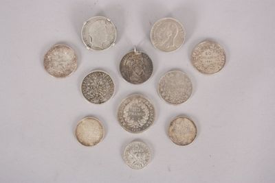 several different types of coins arranged in a circle on a white surface