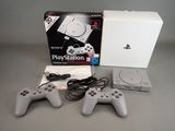 sony playstation playstation game system with two controllers and a charger
