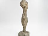an image of a stone sculpture of a woman ' s head on top of a block