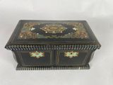 a black box with gold and blue decorations on it