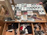 a glass table with a lot of assorted items on it