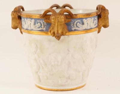 a white vase with a blue and gold decoration on it