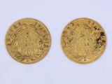 two gold sovereigns, one of which is a sovereign and the other of which is a sovereign