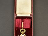 an image of a medal in a red box with a ribbon
