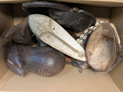 many pairs of shoes in a cardboard box