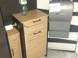 a toilet and a trash can in a small room
