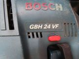 a close up of a bosch power tool on a table