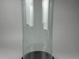 glass bell jar with black base on a white background