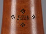a close up of a brown vase with stars on it