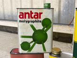 a can of antar molygraphite next to a can of oil
