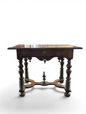 an old wooden table with a marble top on a white background