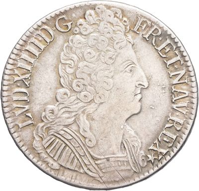 a silver coin with an image of a woman in profile