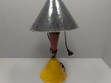 a lamp that is sitting on a table in a room