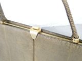 a close up of a purse with a handle