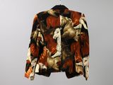 an image of a jacket hanging on a hanger on a wall