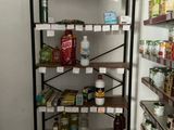 a rack of food in a store with labels on it