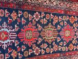 an oriental rug is laying on the floor in a room