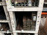 a lot of different types of steel bars on the shelves