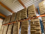 a large amount of boxes stacked on a pallet in a warehouse