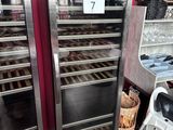 two refrigerators that are next to each other in a store
