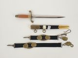 four different types of knives and a keychain on a white surface