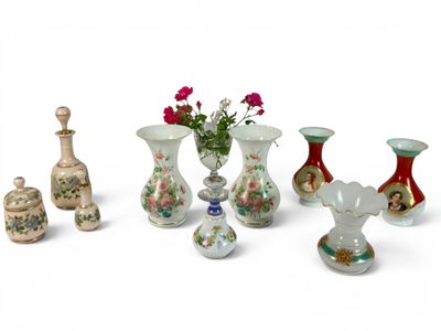 many vases and vases that are sitting on a white surface