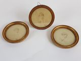 three framed portraits of a woman and a man in a gold frame