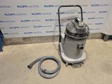 the vacuum is sitting on the floor next to a hose