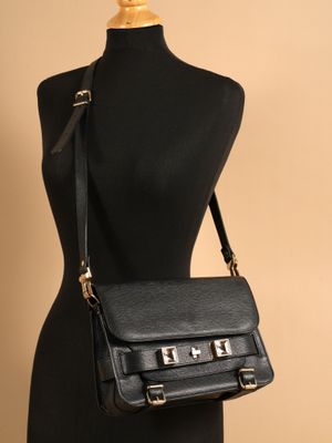 a black leather bag on a mannequin mannequin mannequin mannequin mannequin mannequin mannequin mannequin manne