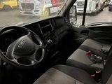 a view of the inside of a truck from the driver ' s seat