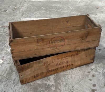 two wooden boxes that are sitting on the ground