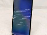 the back of a black samsung s9 with a display on the screen
