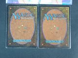 two decks of magic the gathering are shown on a table