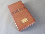 a small wooden box that has a label on it