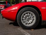 a red sports car parked in a parking lot