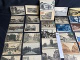 a lot of old postcards that are on a table