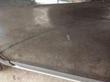 an image of a car that is parked in a garage